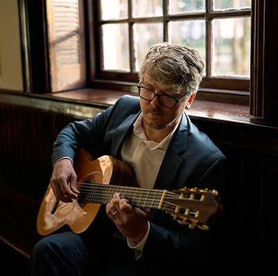 Dr. Adam Kossler, guitar